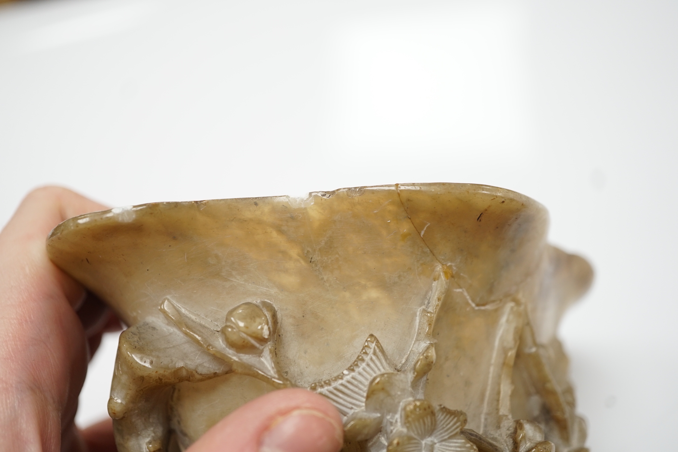 A Chinese carved soapstone libation cup, late 19th century and an elm cased inkstone
